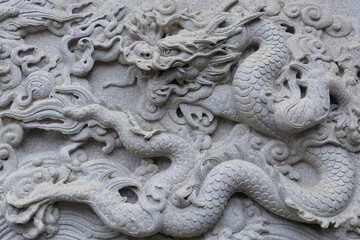 Chinese traditional cultural element architecture - stone carving nine Dragon Wall.