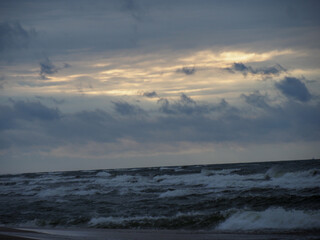 Sea During Stormy Dawn-Dusk with Dramatic Sky and Glimpses of Light