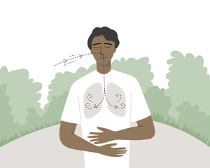 A young man breathing in nature for manage his stress and anxiety.