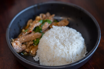 Rice with Kaprao beef served on plate. It is Thai style stir-fried holy basil with meat.