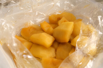 Baking sleeve with fresh hot baked apples on baking sheet on kitchen. Culinary cuisine, healthy eating, bake concept. Preparing sweet homemade marshmallows apple dessert dish meal food.