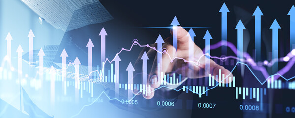 Businessman interacting with financial charts and graphs on transparent screen.