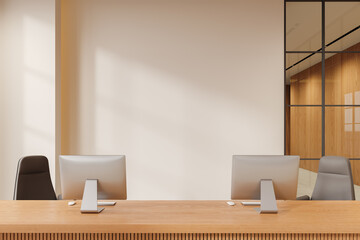 Beige office reception interior desk with computers, mockup wall