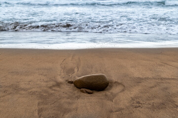 Red stone on the beach