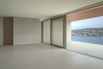 Spacious modern living area with expansive views of the lake and surrounding landscape