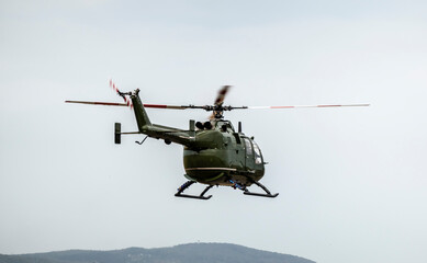 A military helicopter pilot demonstrates the technical skills and capabilities of the helicopter