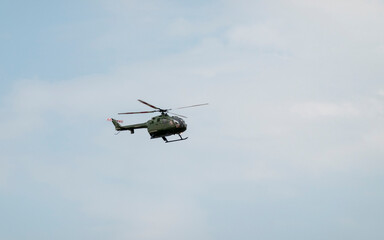A military helicopter pilot demonstrates the technical skills and capabilities of the helicopter