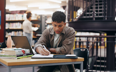African, man and student writing in library for research information, university thesis and study schedule. Male person, laptop and reading for education knowledge, history exam and project planning © LuxeShutter24/peopleimages.com