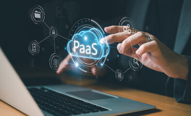 Hand of business people press the button on Cloud platform as a service PaaS to deploy application...