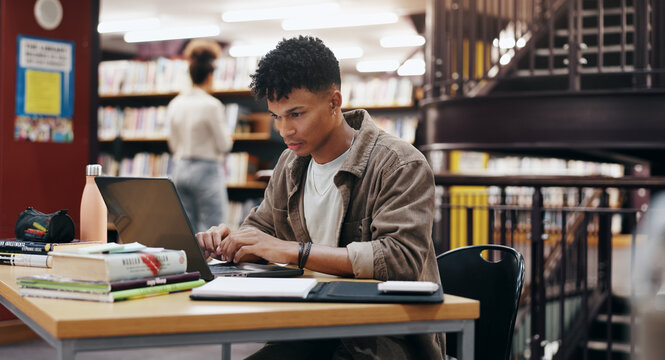 Reading, laptop and research with man in library for knowledge, education and college thesis. Academy, future and university with student and studying on campus for exam, project and scholarship