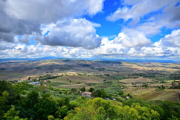 Panoramic view of hilly farmland under a cloudy sky at Molise region Italy