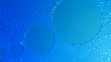 nice background, abstract background of oil bubbles on water with blue light