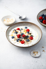 Granola with yogurt, fresh berries and coconut