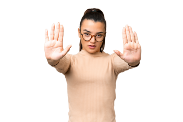 Young beauty woman over isolated chroma key background making stop gesture and disappointed