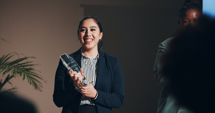 Business woman, smile and celebration at award ceremony as winner, guest or host. Female person, presenter and environmental summit success with conference, seminar or convention for renewable energy