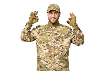 Military man over isolated chroma key background in zen pose