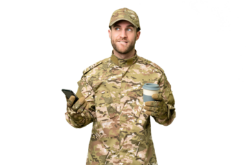 Military man over isolated chroma key background holding coffee to take away and a mobile while thinking something