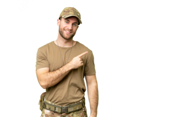 Military with dog tag over isolated chroma key background pointing to the side to present a product