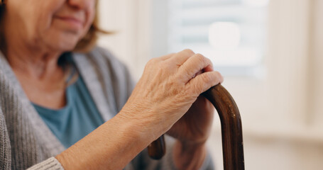 Home, hands and senior woman with walking stick for balance, helping and relax in retirement. Closeup, wooden cane and female person with disability for arthritis, mobility support and osteoporosis