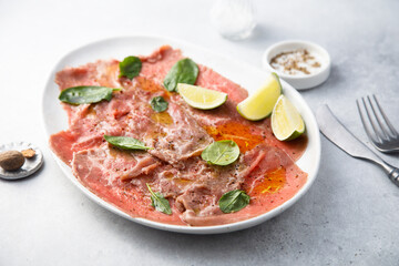 Beef carpaccio with lime and spinach