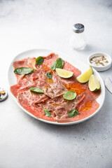 Beef carpaccio with lime and spinach