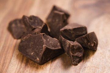 dark chocolate chunks on wood table