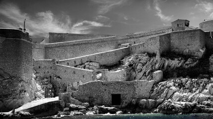 Obraz premium Black-white pictures of the famous Chateau D'If in France not far away from the coast of the city of Marseille. It is famous for being part of adventure novel The Count of Monte Christo