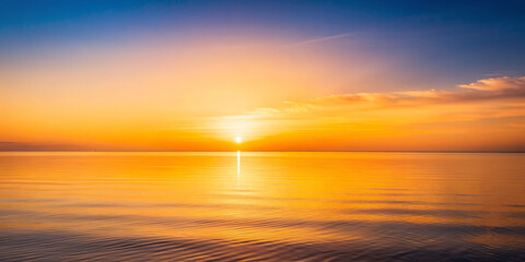 Fototapeta premium stunning sunset over calm horizon, showcasing vibrant orange and yellow hues reflecting on waters surface, creating serene and peaceful atmosphere