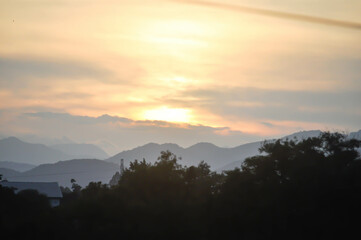 sky ,tree , mountain and house background or a house and tree
