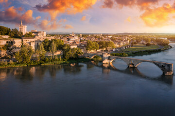 Beautiful view of Avignon with famous bridge Saint-Benezet, medieval architecture along the Rhone River in Avignon, France. The Pont Saint Benezet and the Papal palace in Avignon, South France.