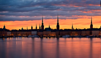 Fototapeta premium Silhouette of the Stockholm skyline with gamla stan framed by a bright blue and orange sunset, Ai Generated