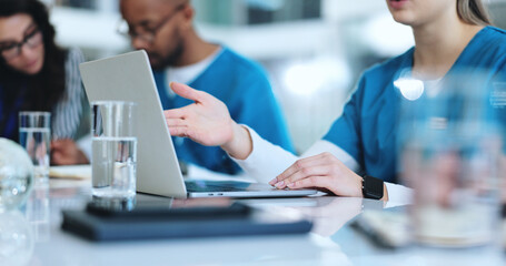 Laptop, meeting and hands of doctors in clinic with research for IRB approval for surgery....