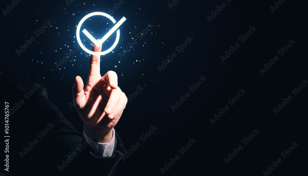 Poster Hand pointing at check mark icon in a dark background.
