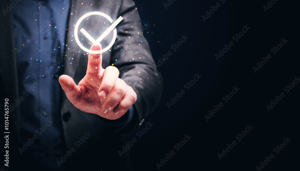 Poster Hand pointing at a glowing check mark icon in a dark background.