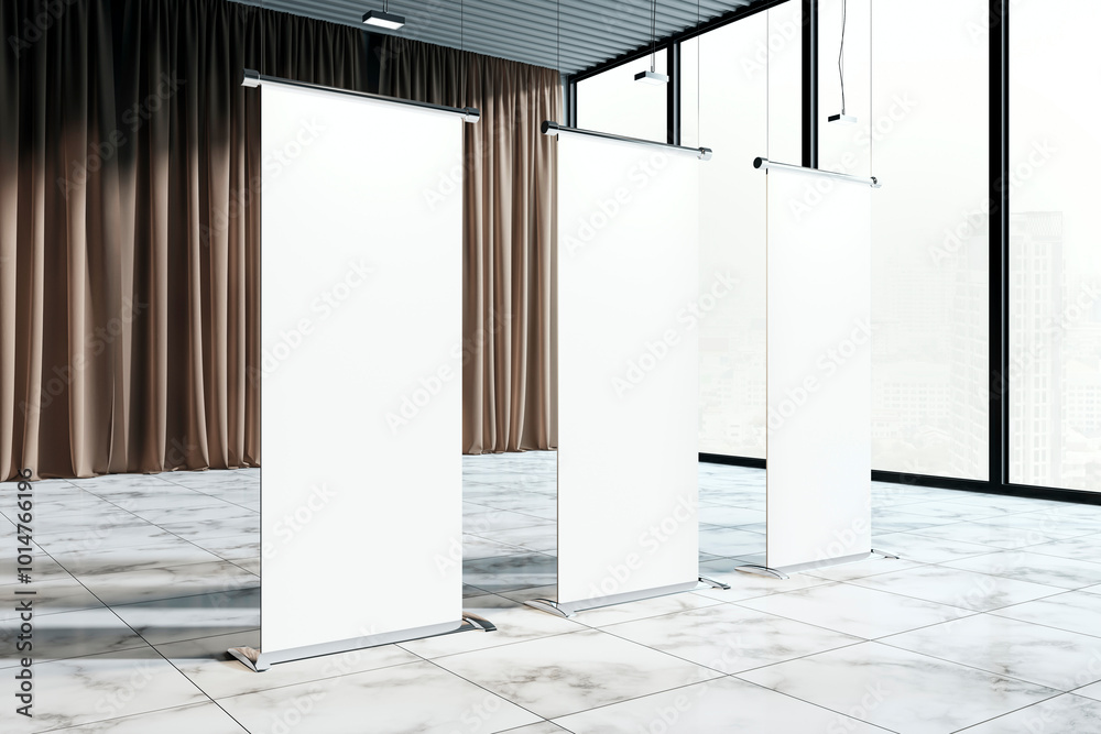 Poster Empty roll-up banners in a modern exhibition space with curtains and large windows. 3D Rendering