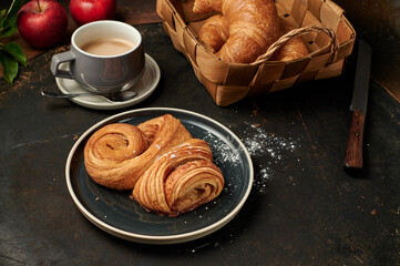 Franzbrötchen an original sweet pastry from Hamburg with a cup of latte