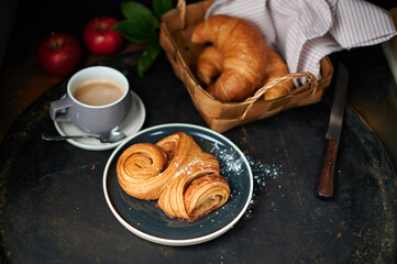 Franzbroetchen an original sweet pastry from Hamburg with a cup of latte