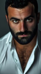 Obraz premium A handsome man with a beard, close-up portrait, an angry look on his face
