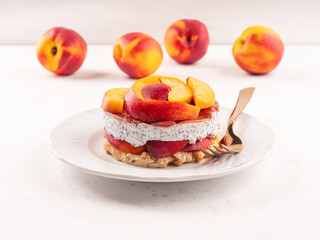 Overnight chia pudding dessert with greek yogurt, peaches and jam