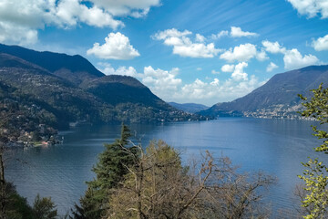 Obraz premium Como city in Italy, view of the city from the lake, with mountains in background 