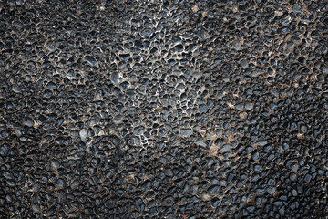 dirty and rough black stone pavement texture and background