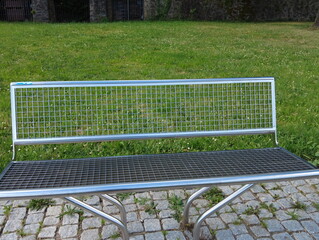 beautiful modern metal bench in the park