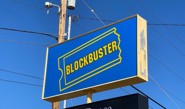 Bend, OR - October 6, 2024 - Exterior street sign outside of the last Blockbuster Video store location. Blockbuster was a video rental store chain that offered DVD, VHS and Video Game Rentals