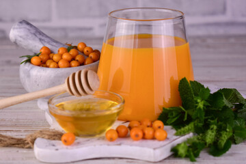 Fruit drink or juice from sea buckthorn berries. Vitamin drink in the fall.