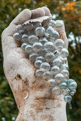 grape wine statue in Badacsony Hungary with a hand holding it