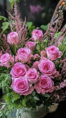 A stunning bouquet of pink roses surrounded by delicate greenery and accents, perfect for any floral arrangement or occasion.