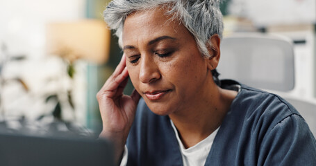 Mature woman, doctor and headache with laptop in hospital for burnout, medical fail and deadline...