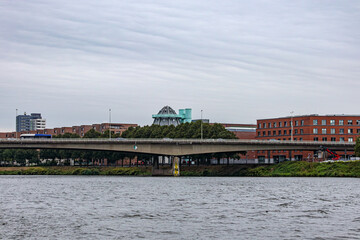 Modern irregularly shaped government building known as Gouvernement aan de Maas, islet on river...