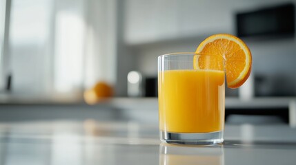 Refreshing Orange Juice in a Glass on a Kitchen Counter