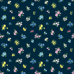 Beautiful floral pattern in small abstract flowers. Small colorful flowers. Dark blue background. Ditsy print. Floral seamless background. Vintage template for fashion prints. Stock 